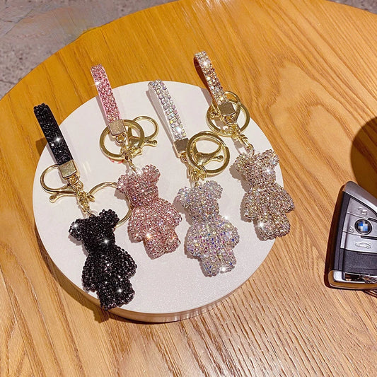 DFShop rhinestone bear keychain in black pink silver and gold with gold keyring on wooden surface