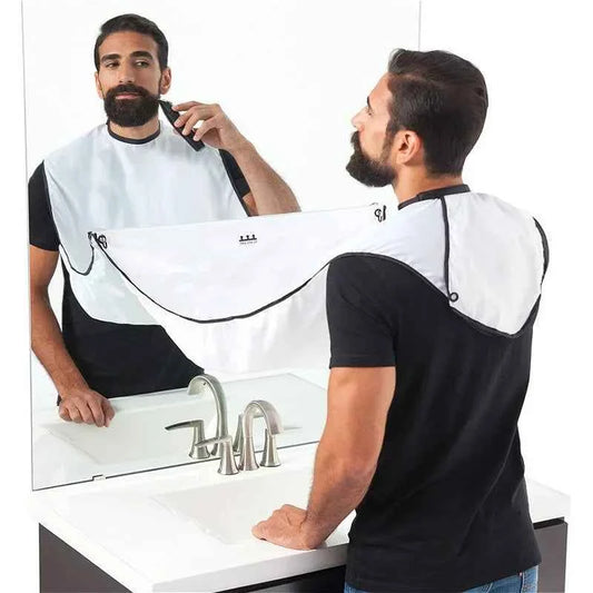 Man using beard trimming bib for men by DFShop while grooming beard in front of bathroom mirror
