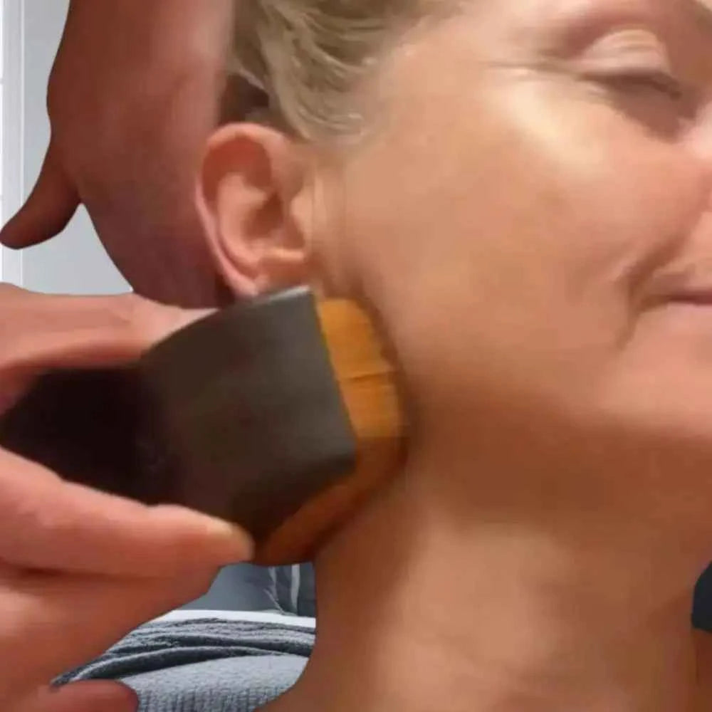 DFShop deep cleansing facial brush being used on a woman's cheek for thorough skin exfoliation