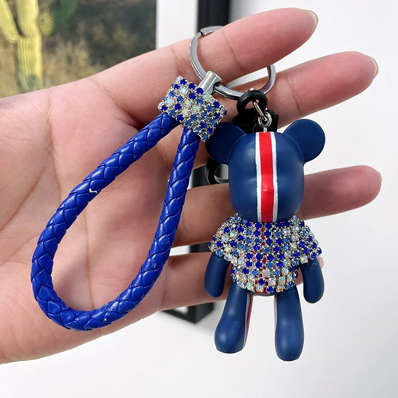 Cute rhinestone bear keychain with blue braided strap and sparkly multicolor rhinestones