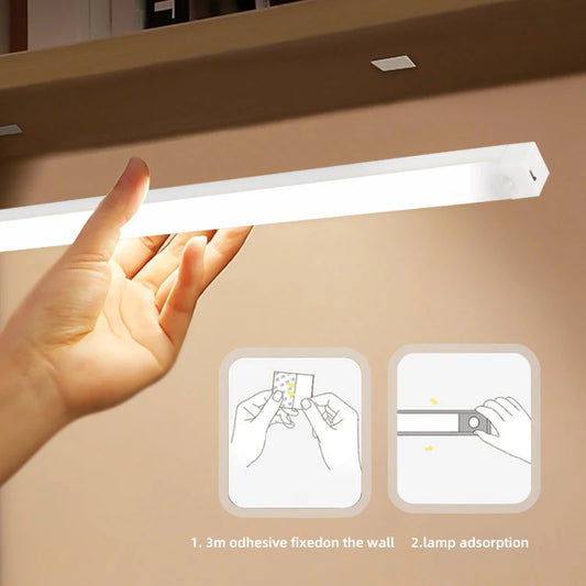 Wireless LED motion sensor night light being installed with adhesive strip under a shelf for easy wall mounting