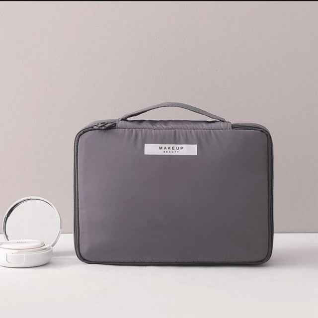 Gray portable cosmetic organizer with handle and zipper closure from DFShop