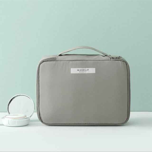 Gray DFShop portable cosmetic organizer with handle and zip closure for easy travel storage