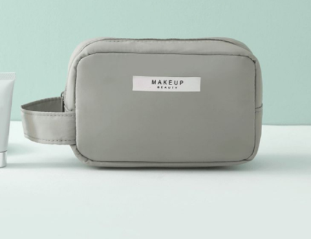 Gray makeup bag portable cosmetic organizer with handle and zipper closure for travel