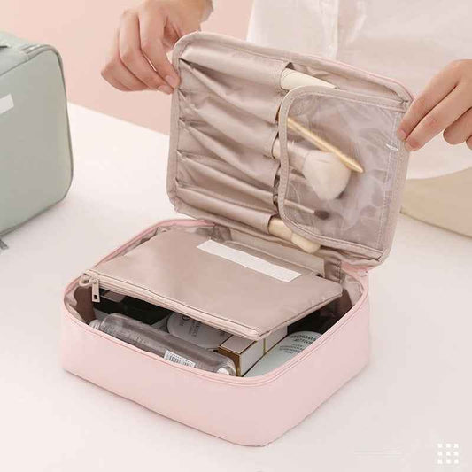 DFShop pink portable cosmetic organizer with multiple compartments holding makeup brushes and skincare bottles