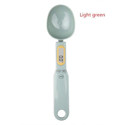 Light green digital measuring spoon scale with LCD display and buttons for precise ingredient measurement