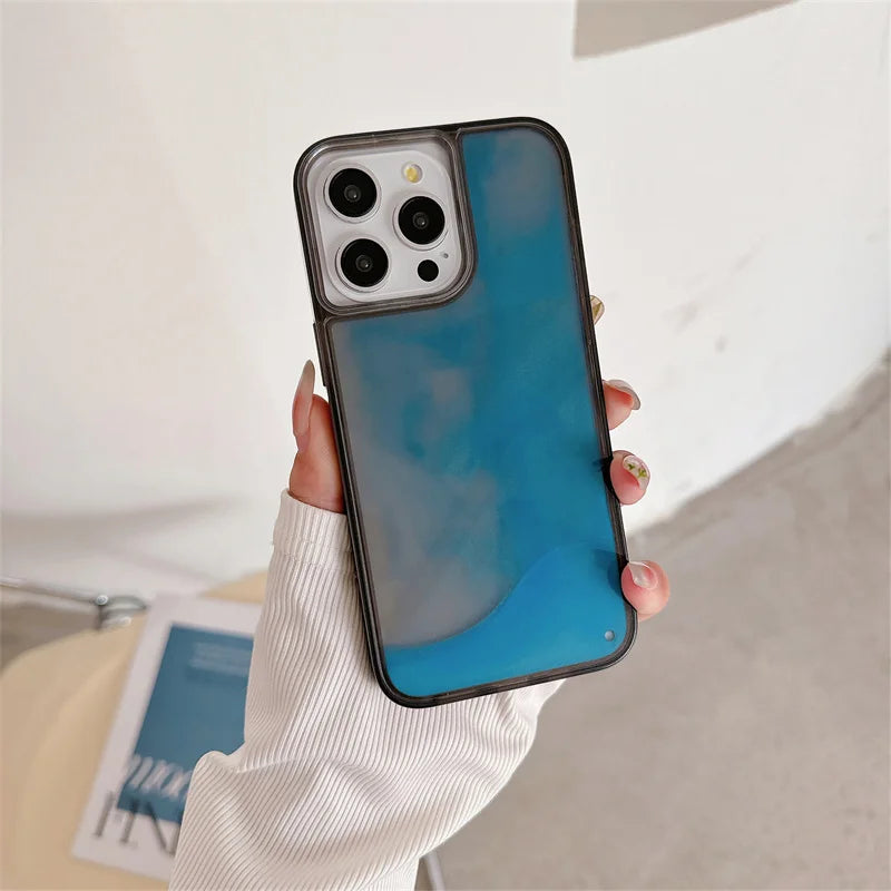 Luminous sand iPhone case with blue translucent design held in hand for stylish phone protection