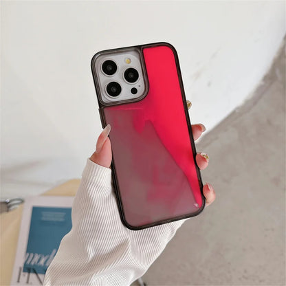 Hand holding a red and black luminous sand iPhone case with triple camera cutout