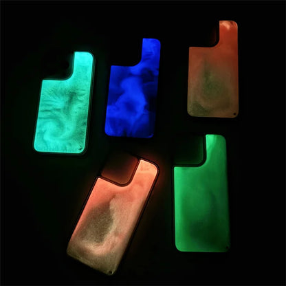 Five colorful luminous sand iPhone case designs glowing in blue green and orange shades on black background