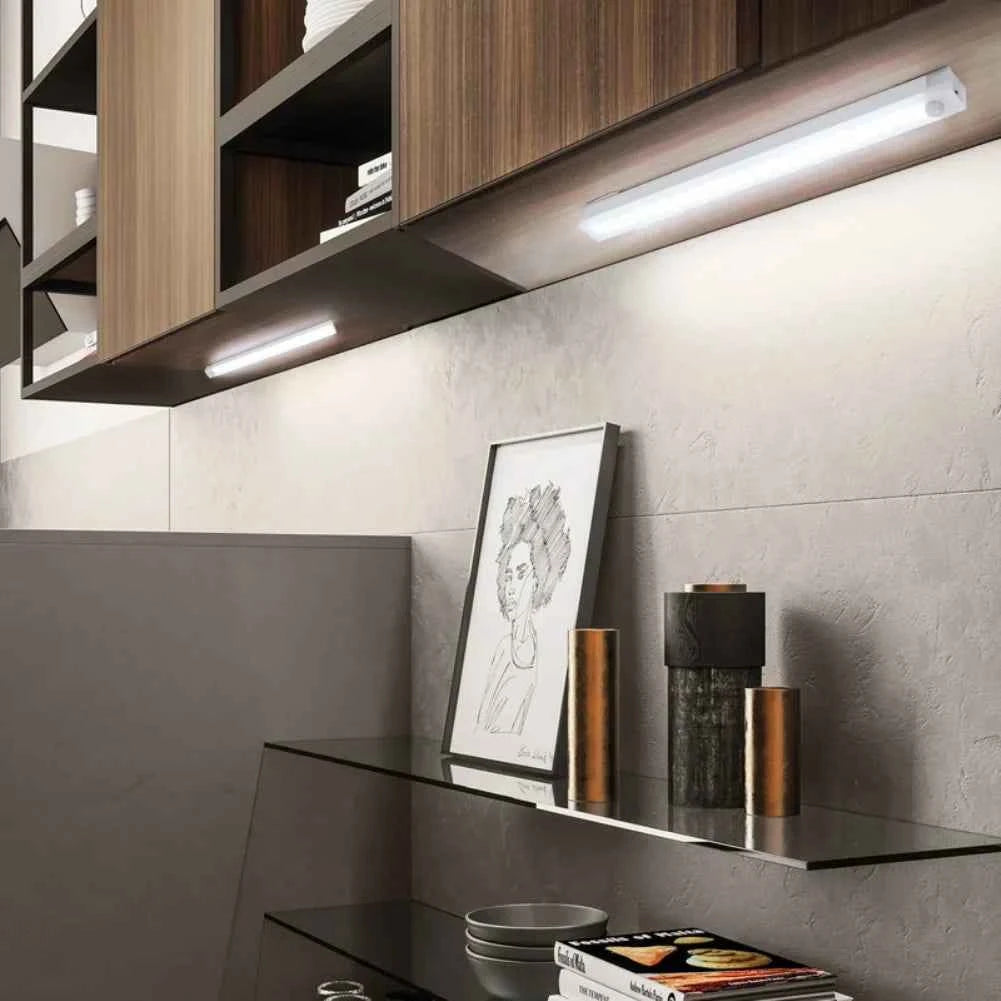 DFShop LED motion sensor light installed under wooden kitchen cabinets illuminating countertop