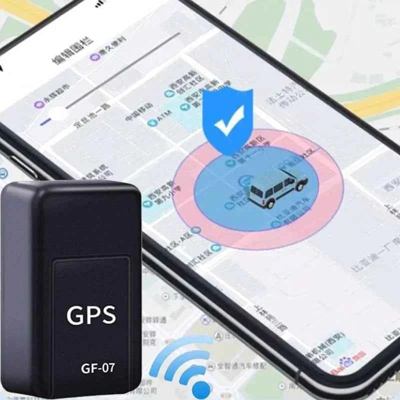 Black micro magnetic GPS tracker GF-07 device next to a smartphone displaying a vehicle tracking map