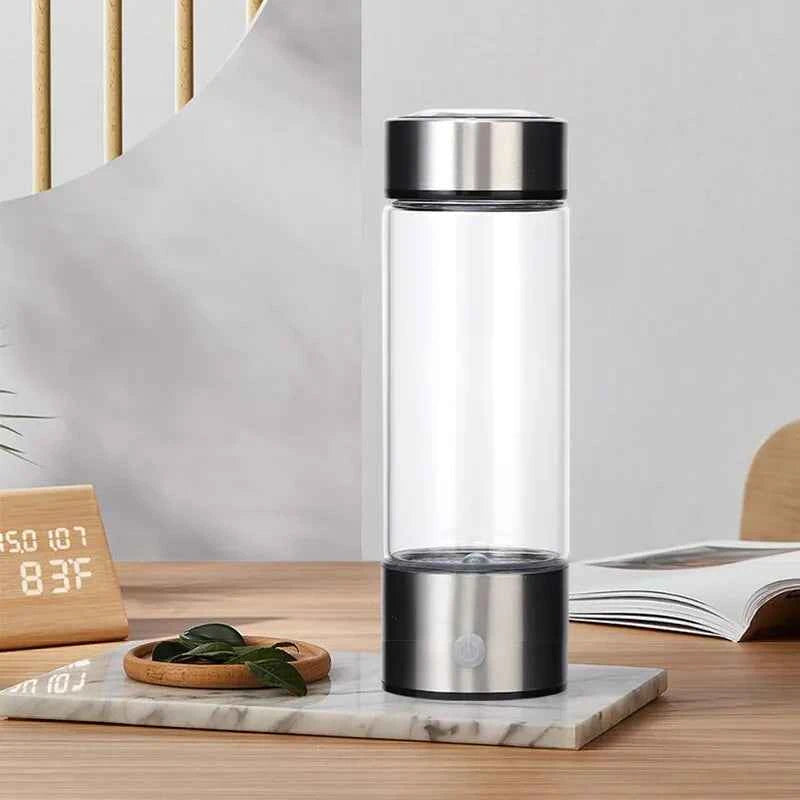Sleek portable hydrogen water generator with stainless steel top and base on wooden table setup