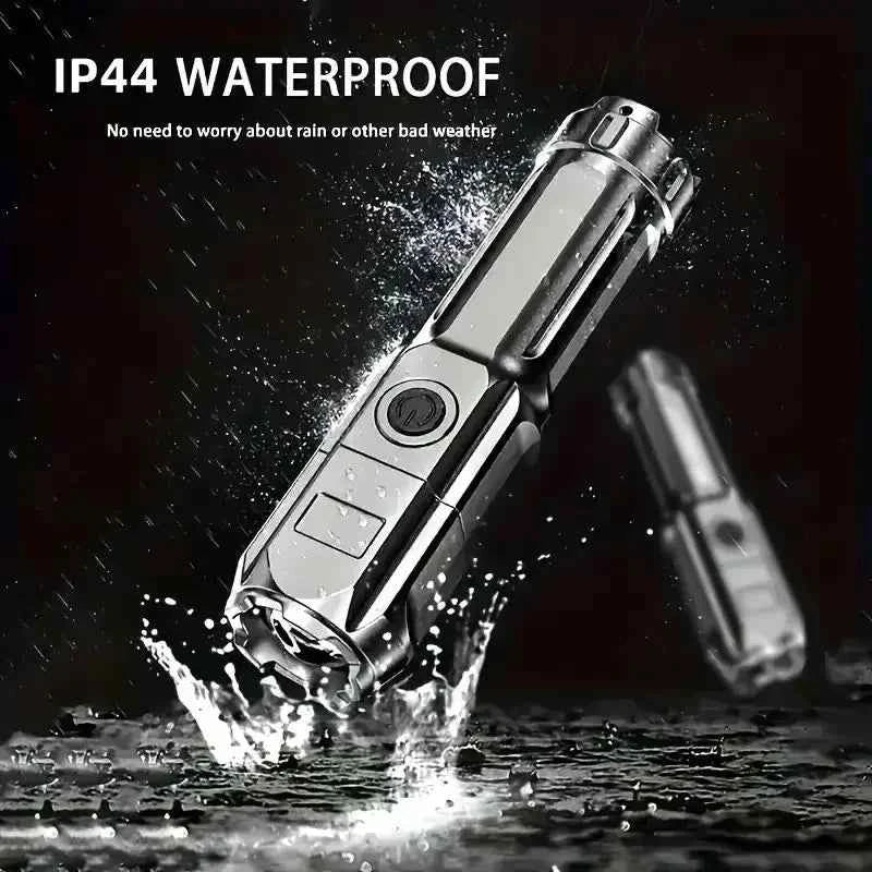 USB rechargeable tactical flashlight by DFShop shown waterproof with water splashes and rain droplets