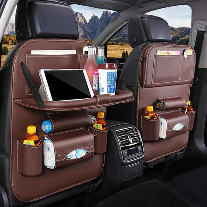 Leather car back seat organizer with multiple pockets holding bottles, tissues, and a tablet in a car interior