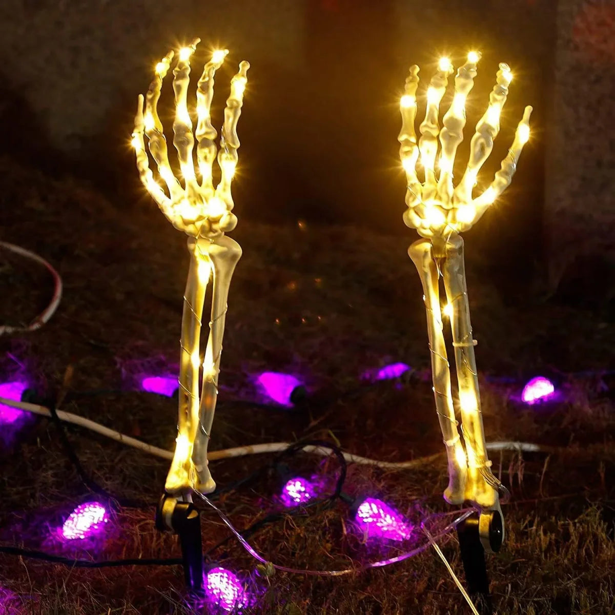 Illuminated Halloween ghost hand lights with glowing skeletal hands and warm white bulbs for spooky decor