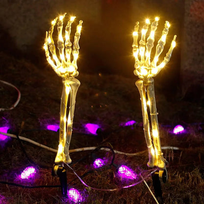 Illuminated Halloween ghost hand lights with glowing skeletal hands and warm white bulbs for spooky decor
