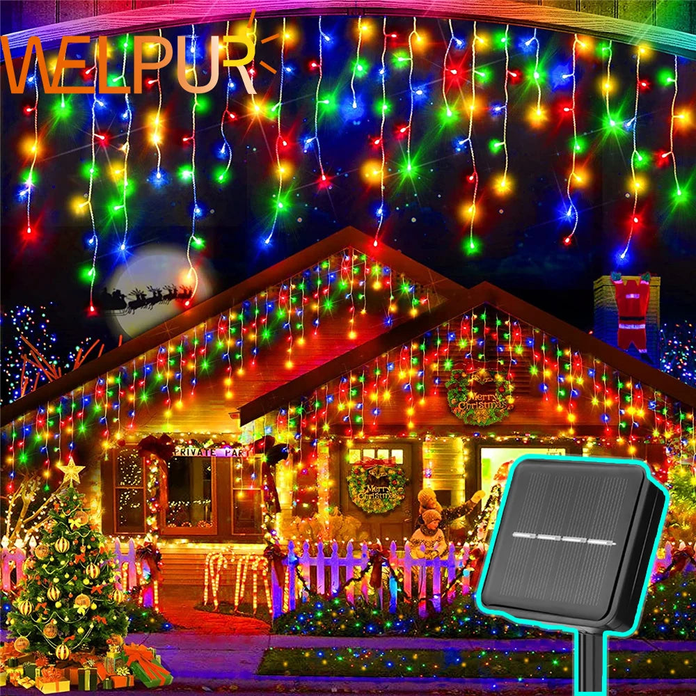Colorful LED solar string lights for garden hanging above house and decorating outdoor Christmas scene