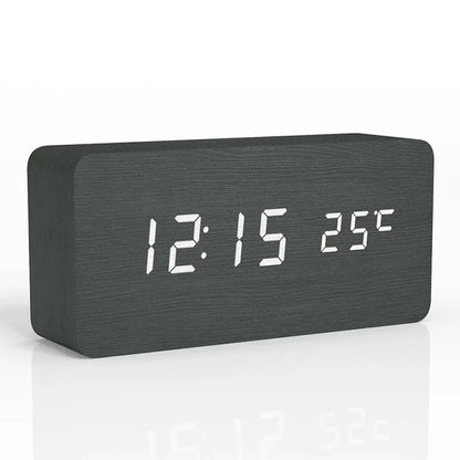 Black wooden digital alarm clock displaying time and temperature with sleek modern design