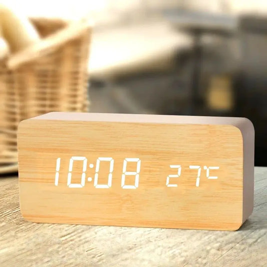 Wooden digital alarm clock displaying time and temperature with modern minimalist design